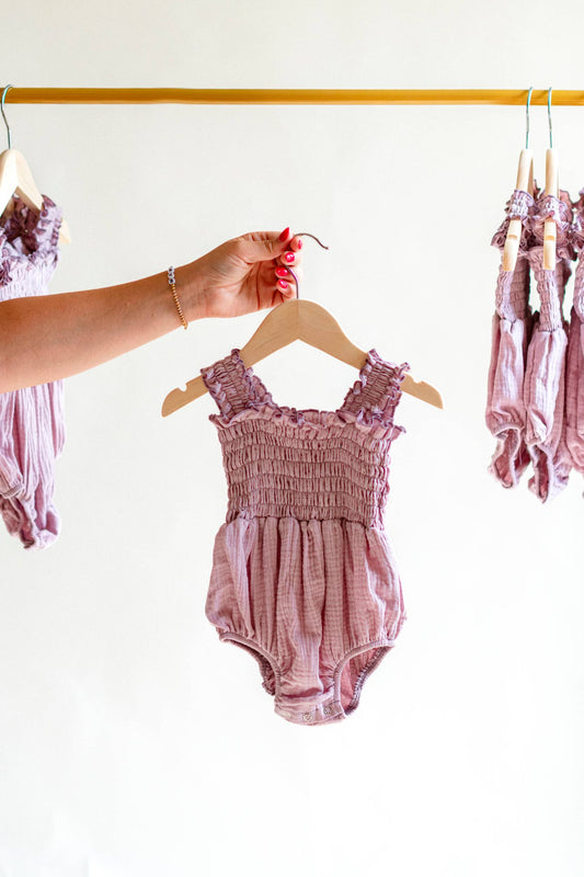 Smocked Ruffle Romper – Lilac Muslin