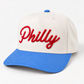 Studio mockup of ivory Philly hat with Carolina blue brim and red 3D puff embroidery